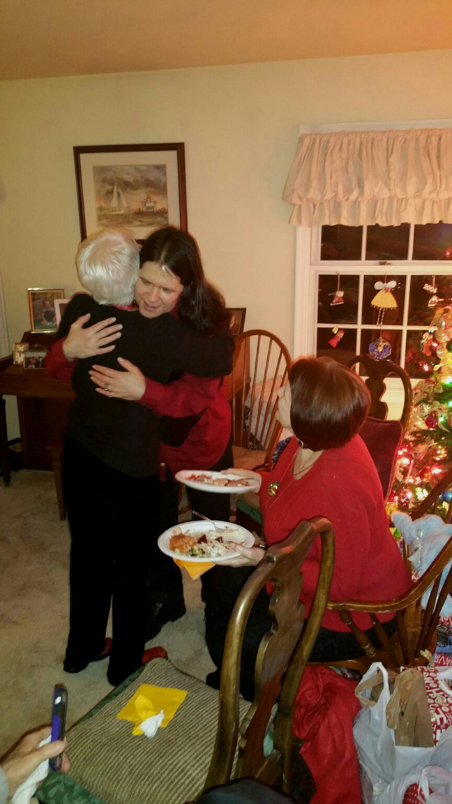 2015 KELLEY FAMILY POLLYANA CHRISTMAS PARTY - FRAN HUGGING THOMAS WITH KATHY