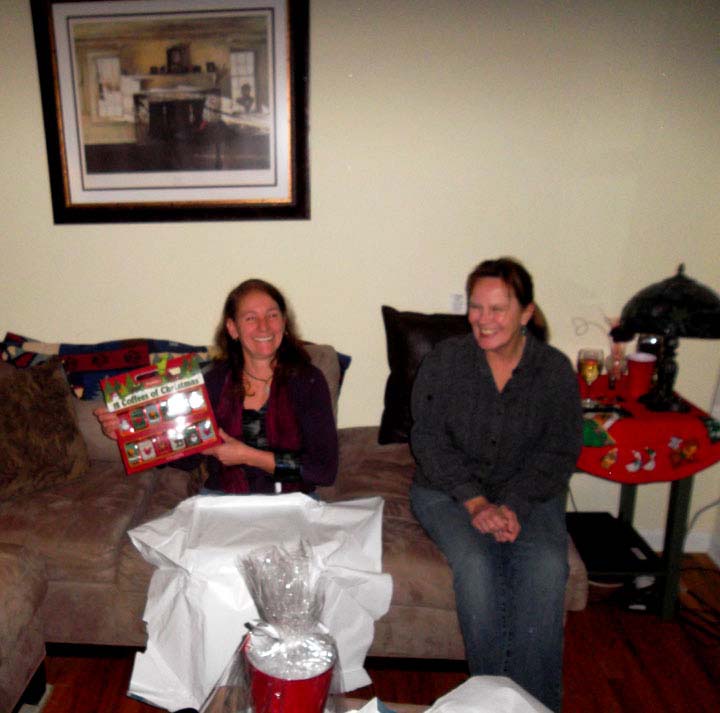 Christmas Eve 2012 - Jill opening present from Jim with Jayne