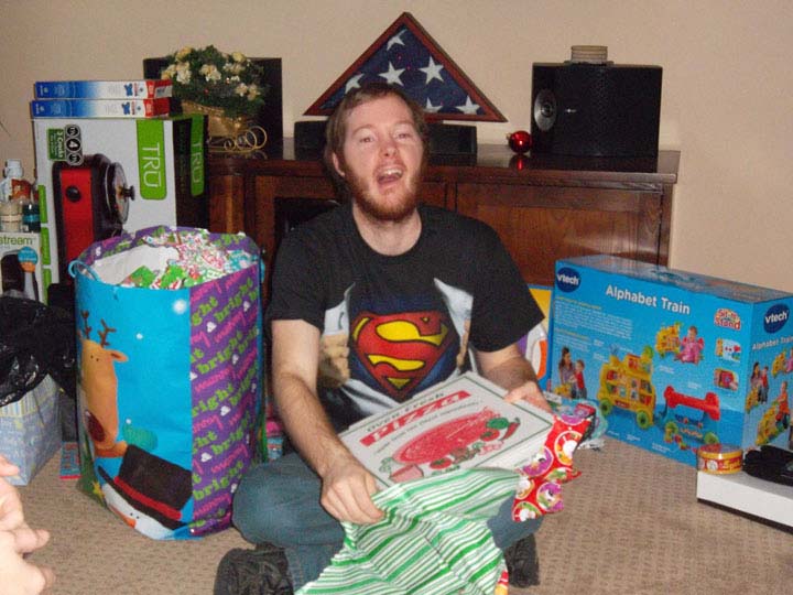 Christmas z Day 2012 - 2 Robby opening gift from Robin at Robins House