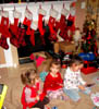 Christmas z Day 2012 - 2 Julieanna Kadie Helena opening gifts at Robins House
