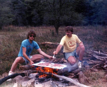 Jack and Jim Kelley cooking over the camp fire