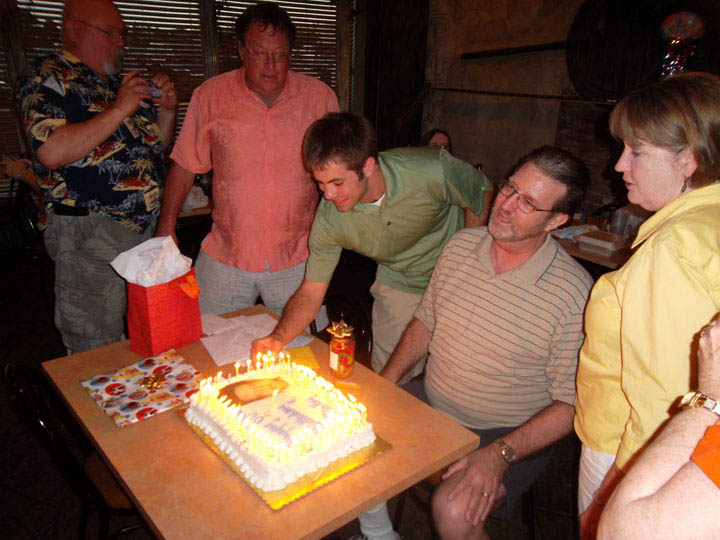 Mickey Kelley 60th B-Day - Mick Maureen Rory lighting cake