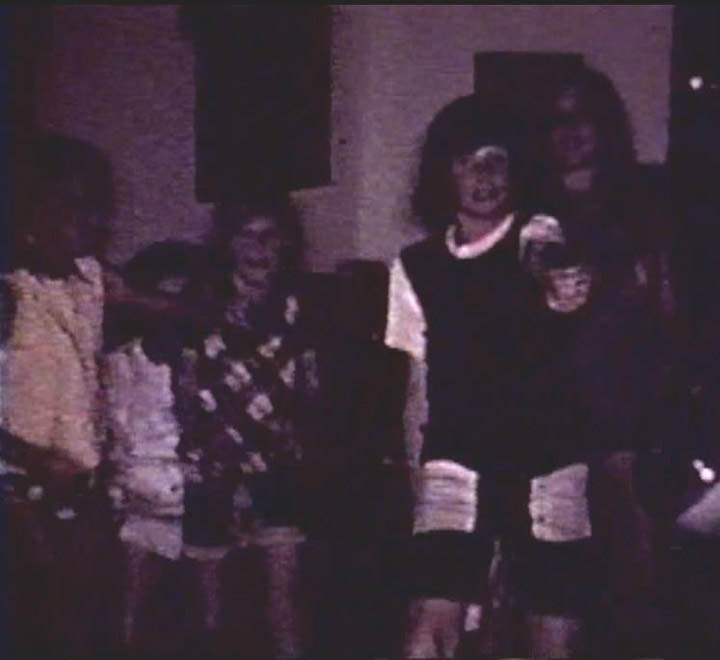 COUSINS DONNA SNADER-JACK AND JIM KELLEY-CAROLYN SNADER WITH GRANDMOM MORGAN FROM AN OLD FAMILY MOVIE SCREENSHOT - 1970s