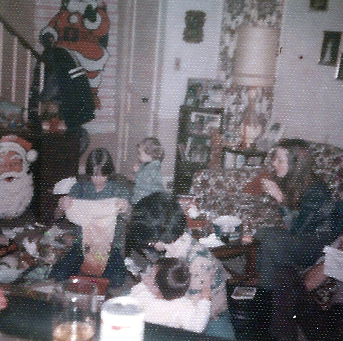 JACK WITH FAMILY IN DAVE KELLEYS LIVING ROOM AT CHRISTMAS EARLY 1970S