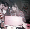 DANNY MICK TOM CHRISTMAS OPENING GIFTS IN DAD LIVING RM VILONE VILLAGE EARLY 1970s