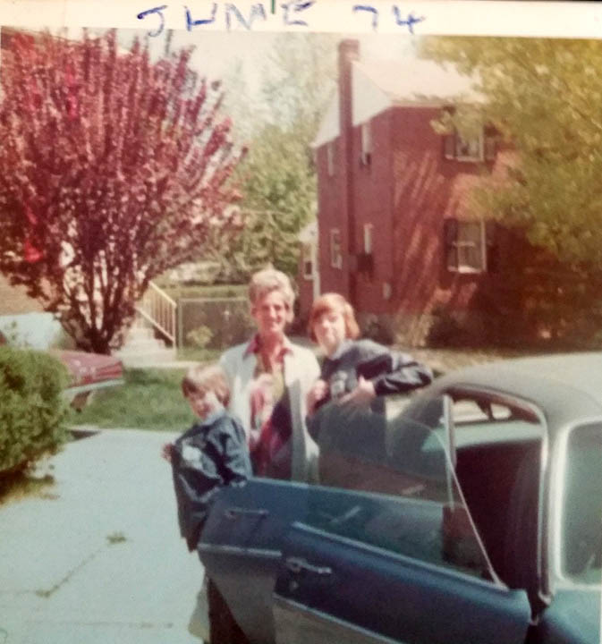 JIM AND JACK KELLEY IN THEIR POLISH LIBRARY LITTLE LEAGUE JACKETS WITH THEIR FATHERS GIRLFRIEND MARY JUNE 1974