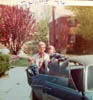 JIM AND JACK KELLEY IN THEIR POLISH LIBRARY LITTLE LEAGUE JACKETS WITH THEIR FATHERS GIRLFRIEND MARY JUNE 1974